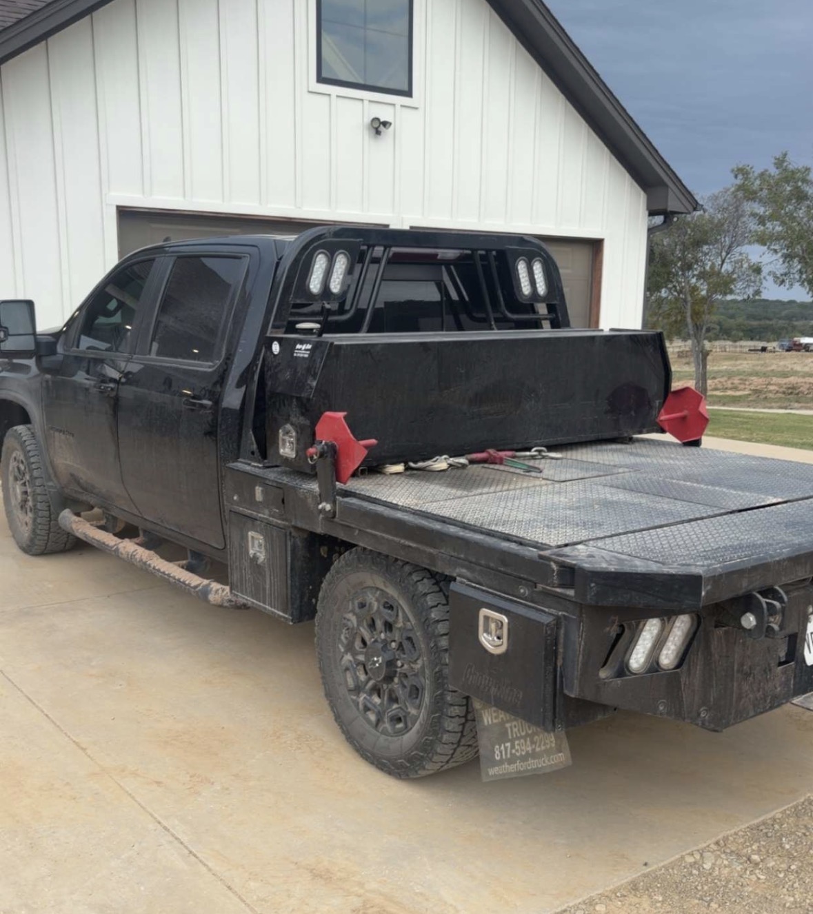 Aaron's black pickup truck with its Rockin Y transfer tank